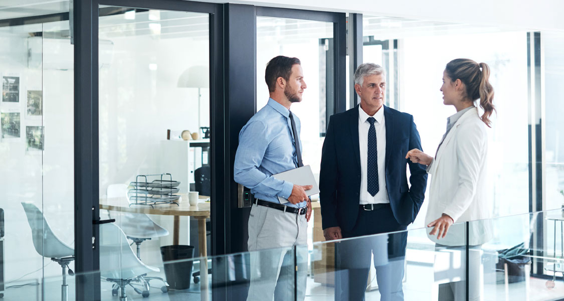 Sponsor finance professionals listening to a client from a private equity firm