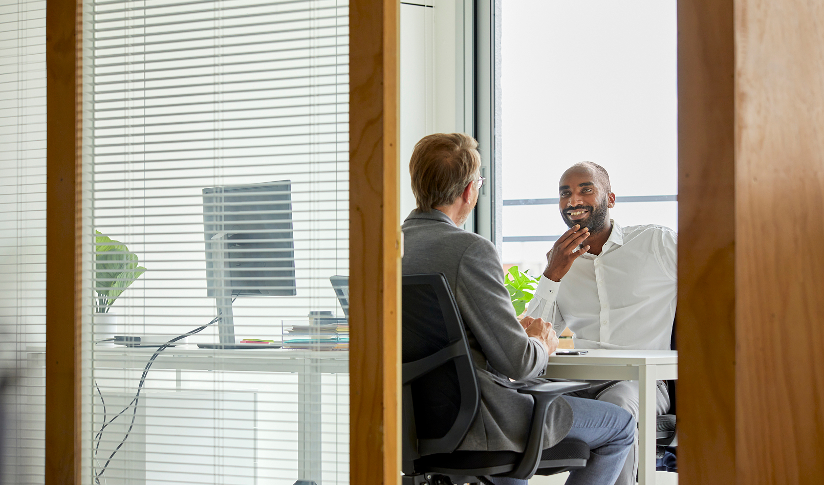 Commercial bankers meeting in a well-lit office