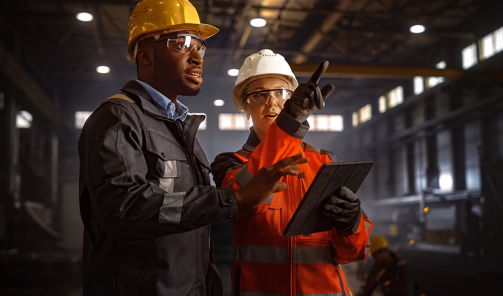 Two inspectors touring a factory