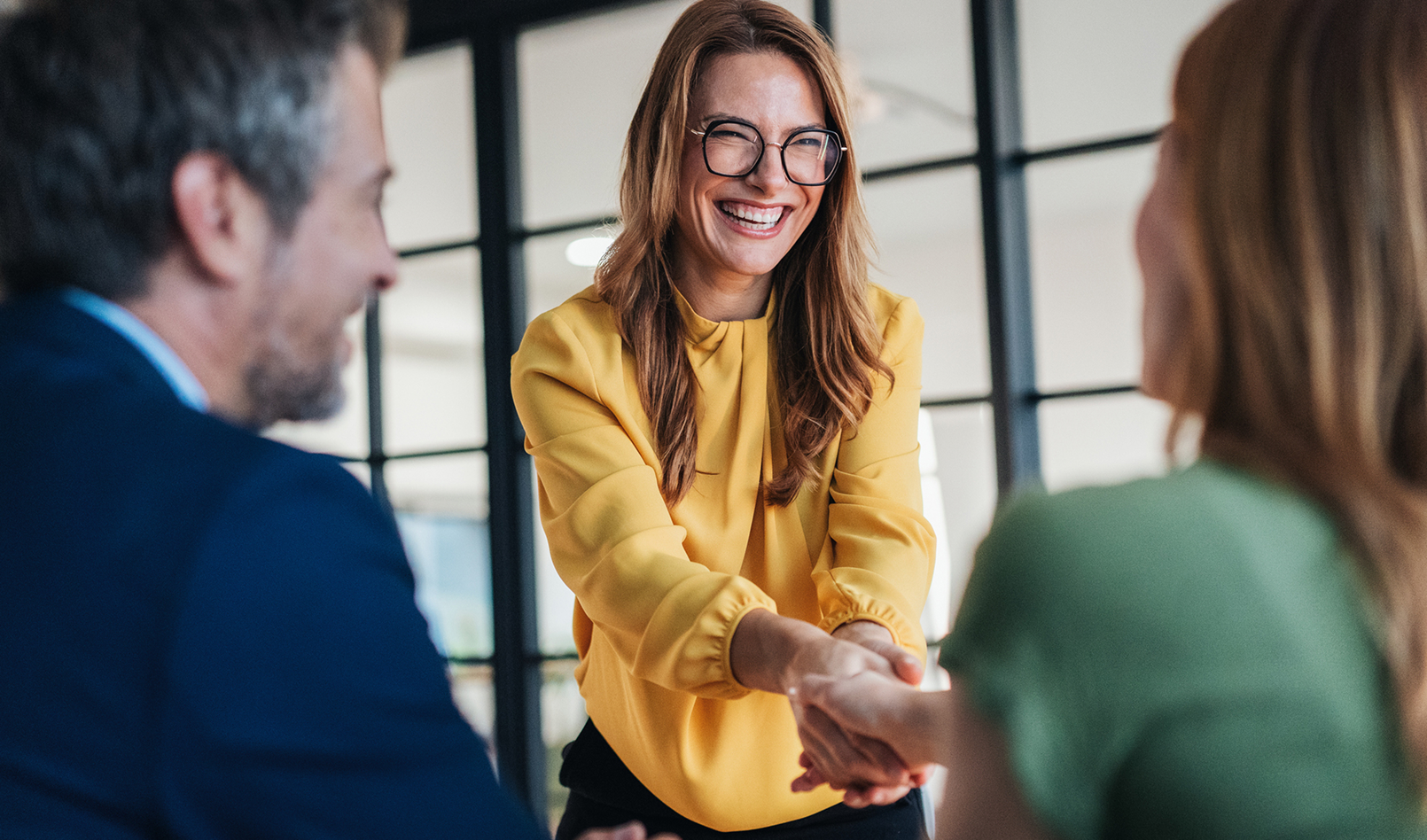A small business banker meeting with clients