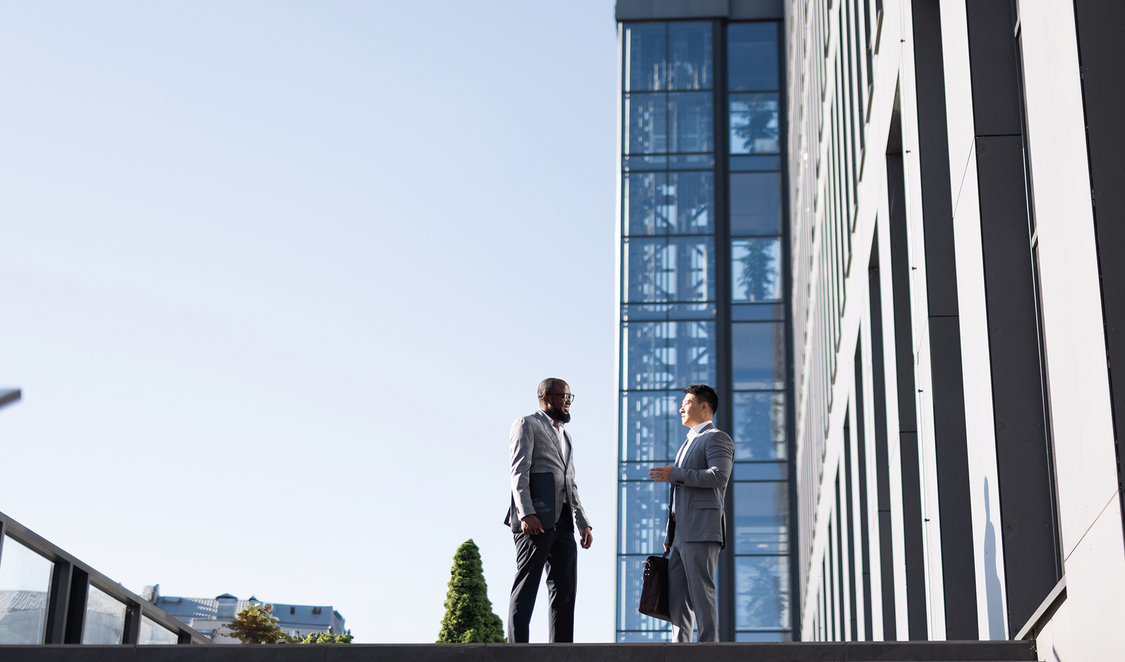 Two bankers discussing current events