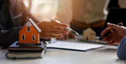 A banker reviewing a portfolio of loans