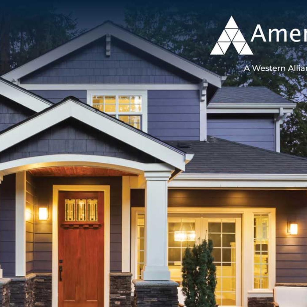 A big, modern home and the AmeriHome Mortgage logo