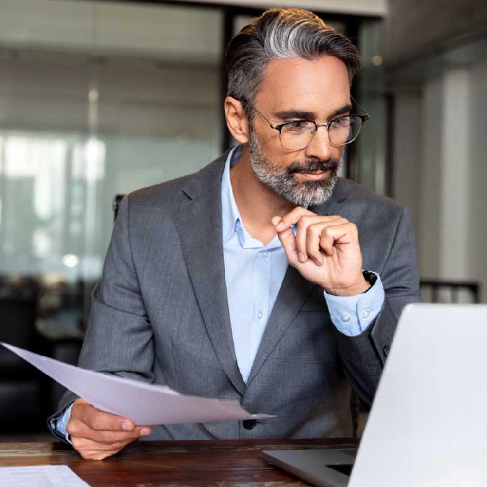 An accountant paying invoices